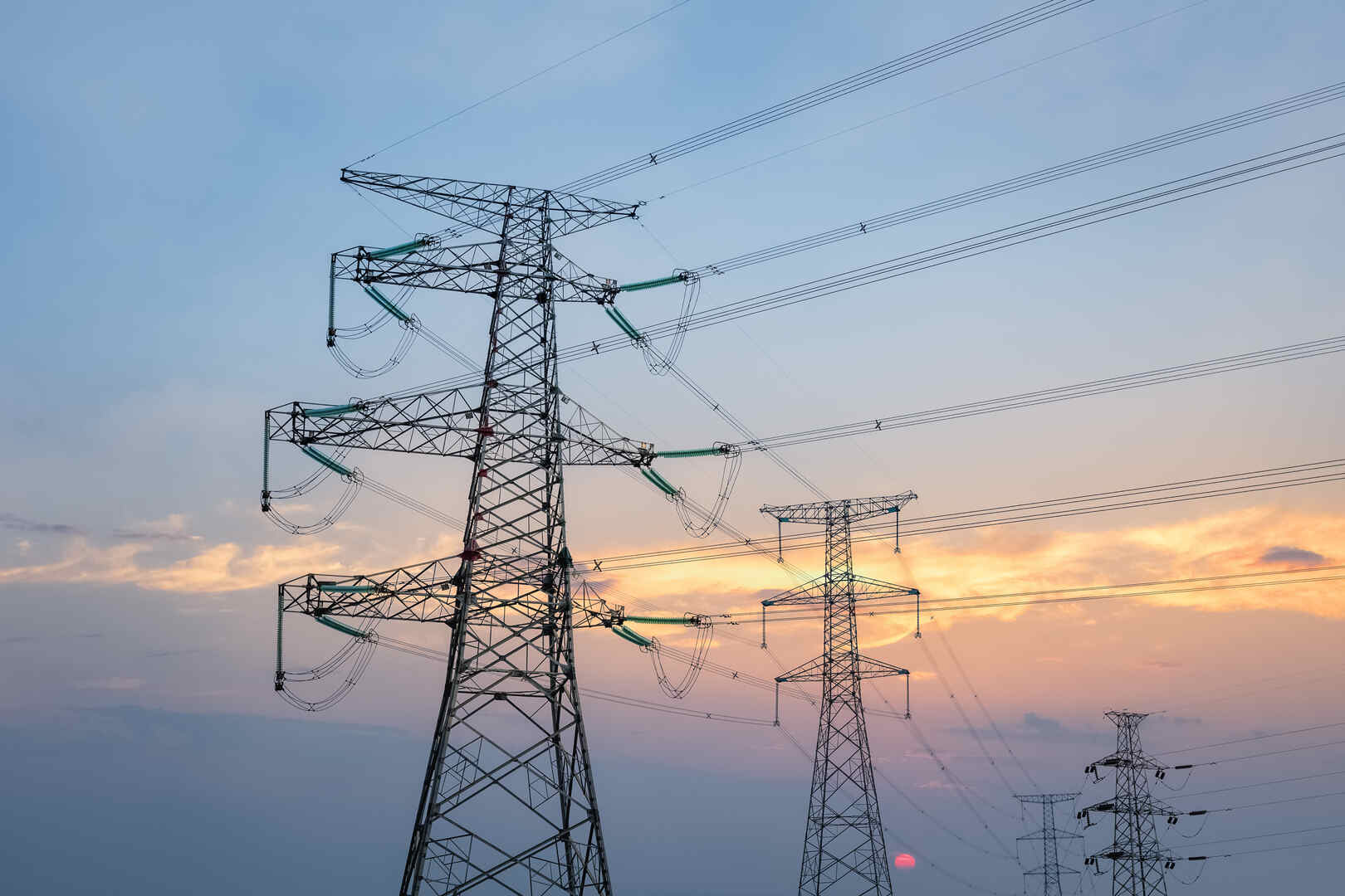 transmission line tower in sunset, steel pylon background
